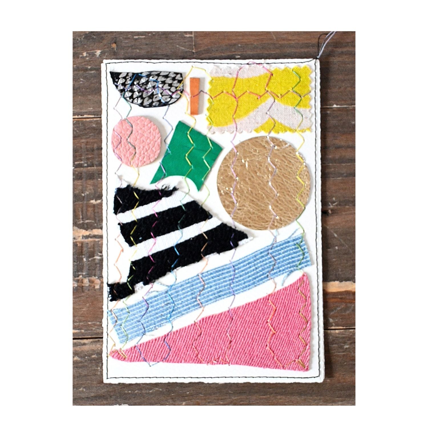 Colorful patchwork design on a wooden surface