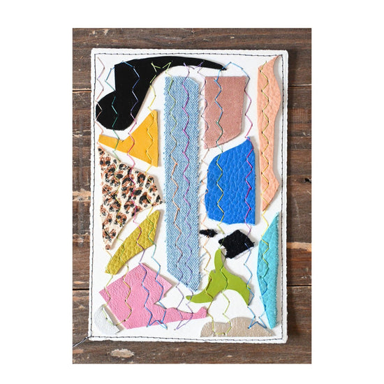 Collage of colorful fabric pieces on a wooden background