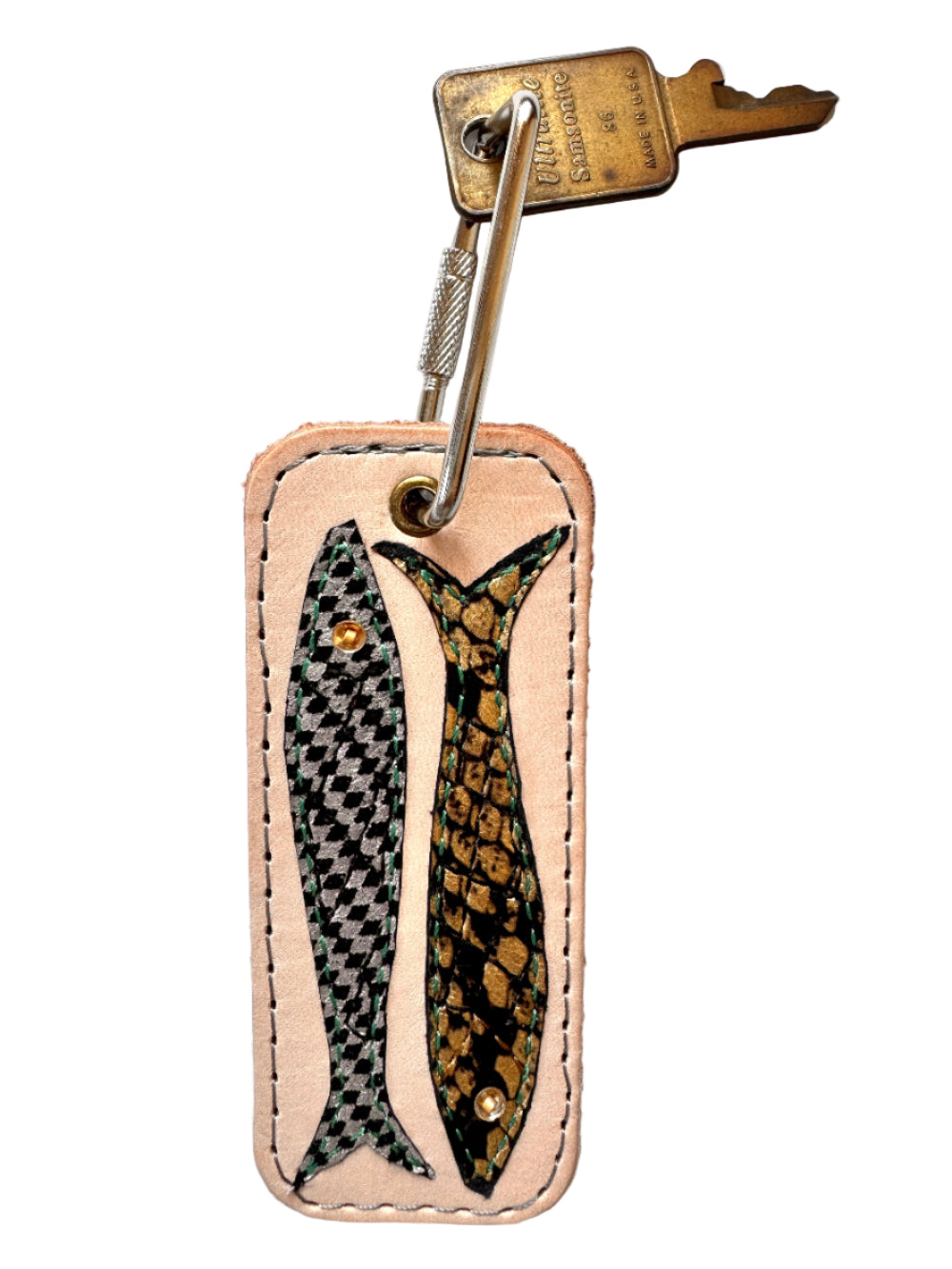 Leather keychain with fish design on a white background