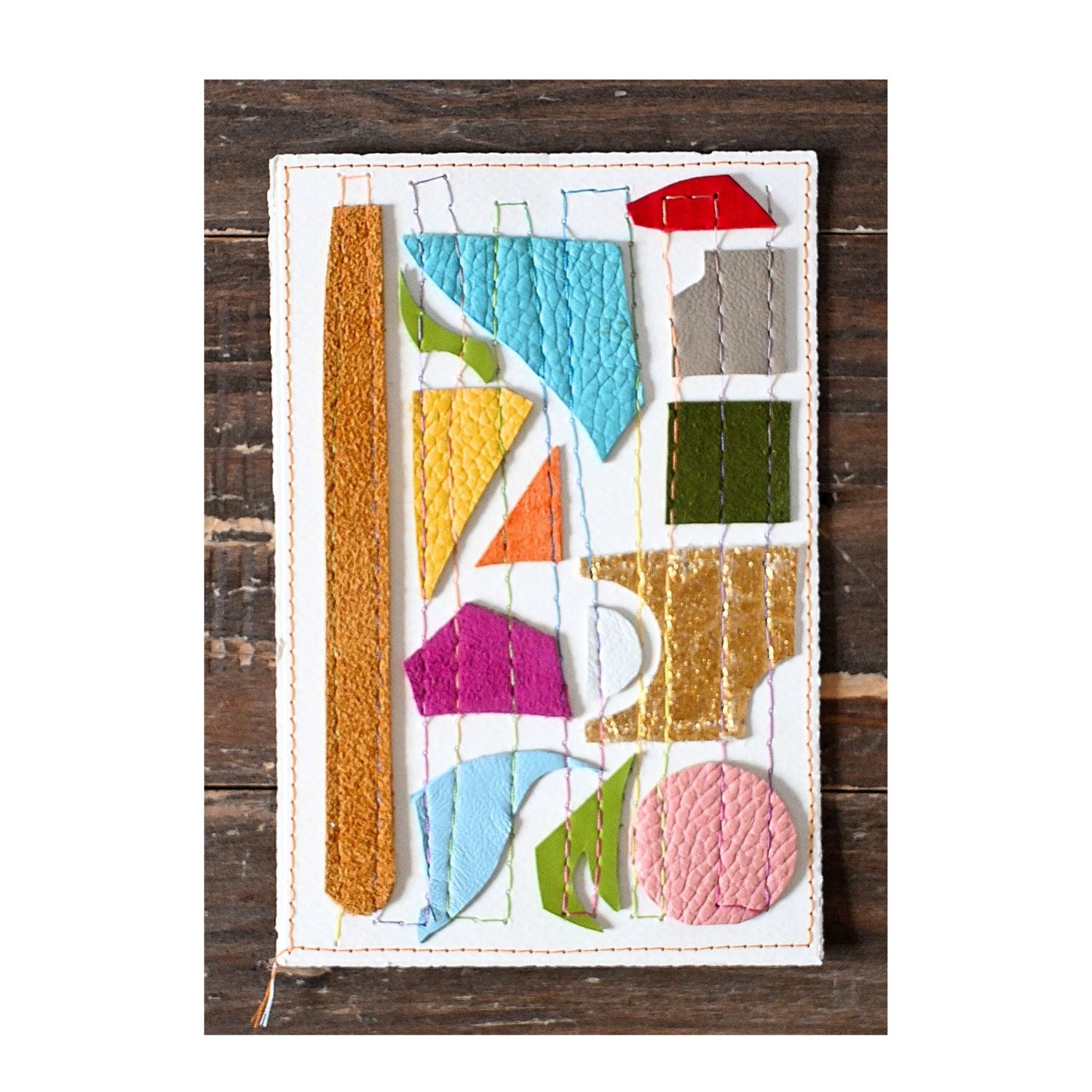 Colorful geometric shapes on a white background with a wooden frame