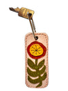 Keychain with floral design on a white background
